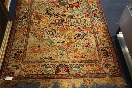 An early 20th century Kirman hunting rug, 6ft 5in by 4ft 2in.